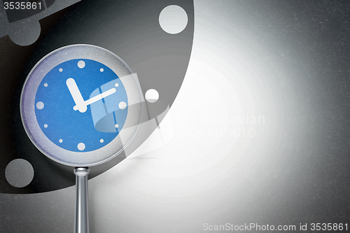 Image of Timeline concept:  Clock with optical glass on digital background