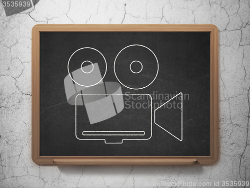 Image of Travel concept: Camera on chalkboard background