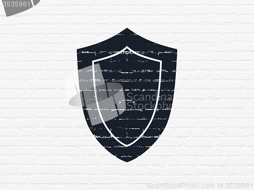 Image of Protection concept: Shield on wall background