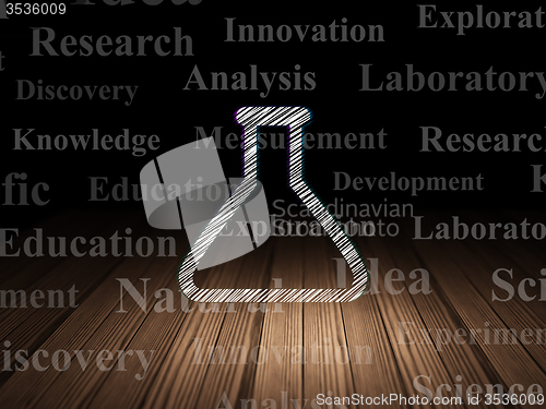 Image of Science concept: Flask in grunge dark room