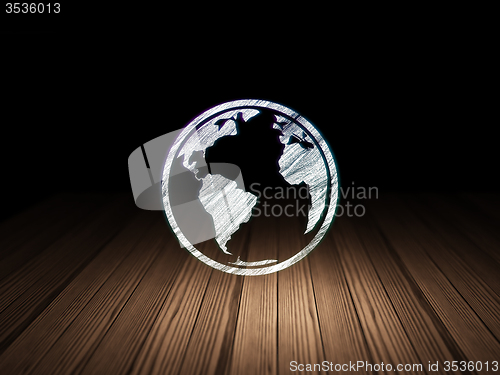 Image of Learning concept: Globe in grunge dark room