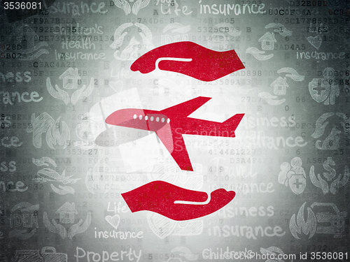Image of Insurance concept: Airplane And Palm on Digital Paper background