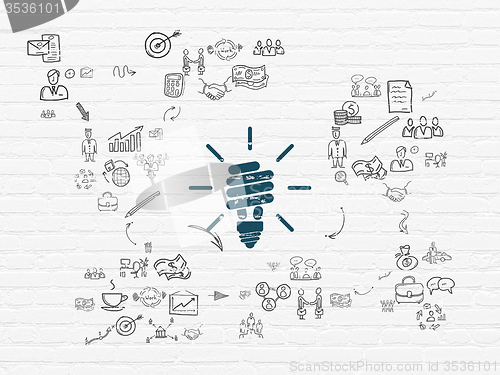 Image of Finance concept: Energy Saving Lamp on wall background