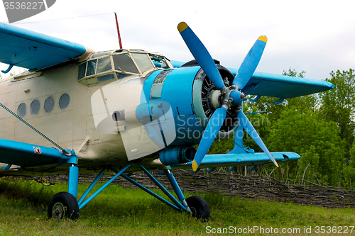 Image of Old retro airplane on green grass 