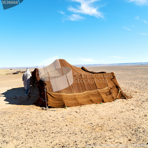 Image of tent in  the desert of morocco sahara and rock  stone    sky