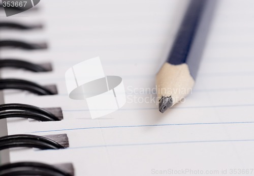 Image of pencil on notebook