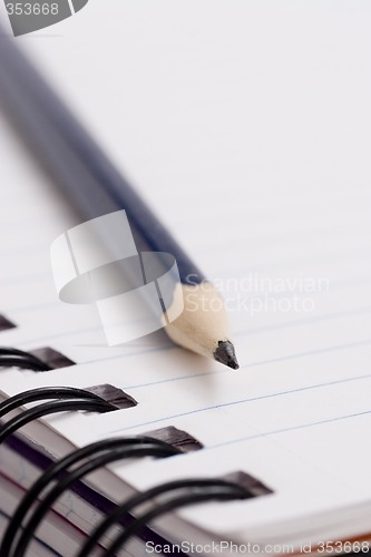 Image of pencil on notebook