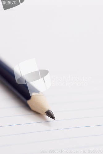 Image of pencil on notebook