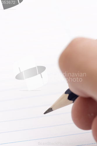 Image of pencil in hand