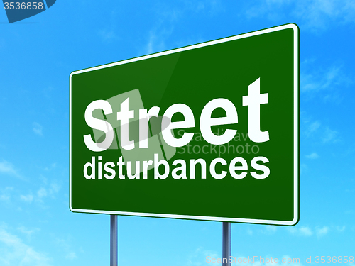 Image of Politics concept: Street Disturbances on road sign background