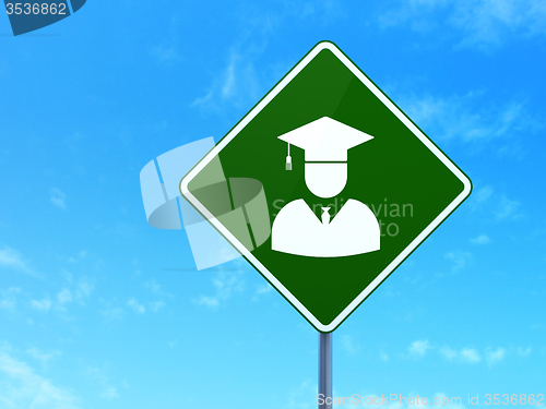 Image of Education concept: Student on road sign background