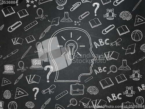 Image of Learning concept: Head With Lightbulb on School Board background