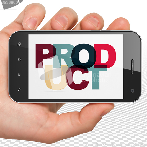 Image of Marketing concept: Hand Holding Smartphone with Product on  display