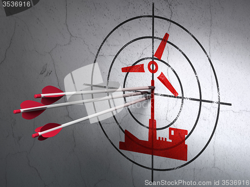 Image of Manufacuring concept: arrows in Windmill target on wall background