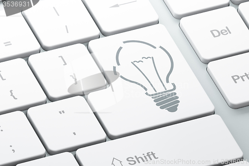 Image of Finance concept: Light Bulb on computer keyboard background