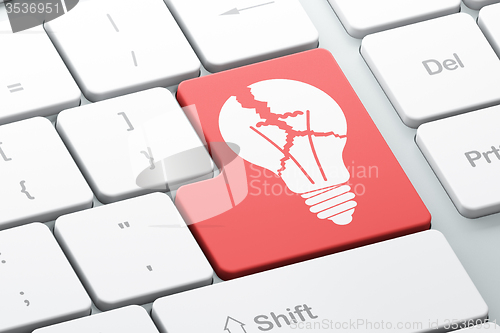 Image of Finance concept: Light Bulb on computer keyboard background