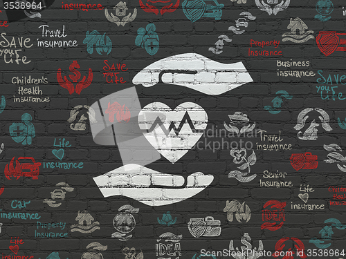 Image of Insurance concept: Heart And Palm on wall background