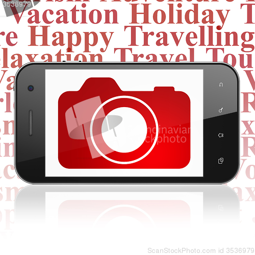 Image of Vacation concept: Smartphone with Photo Camera on display