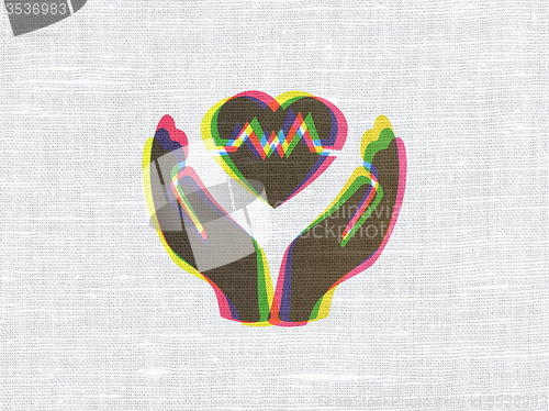 Image of Insurance concept: Heart And Palm on fabric texture background