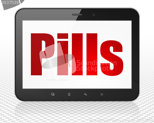 Image of Health concept: Tablet Pc Computer with Pills on display