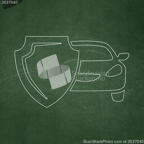 Image of Insurance concept: Car And Shield on chalkboard background