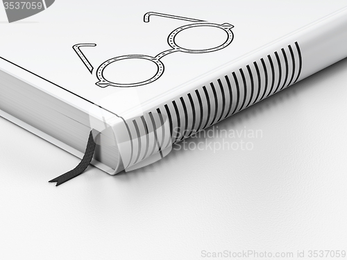 Image of Education concept: closed book, Glasses on white background