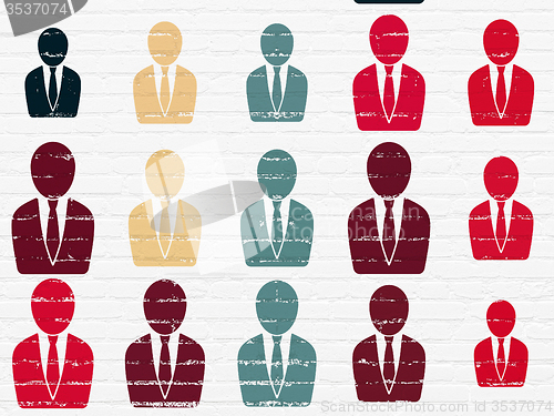 Image of Advertising concept: Business Man icons on wall background