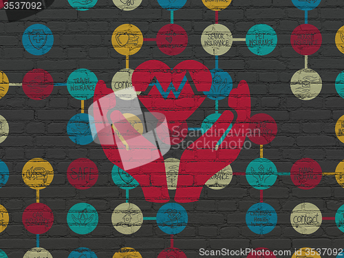 Image of Insurance concept: Heart And Palm on wall background