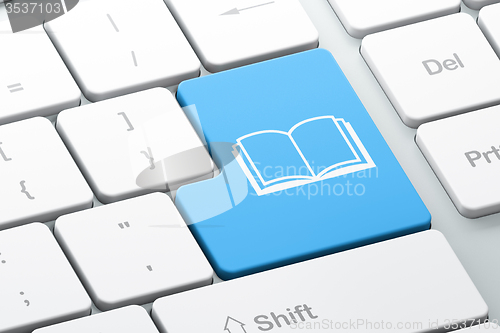 Image of Learning concept: Book on computer keyboard background