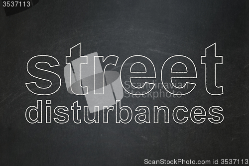 Image of Political concept: Street Disturbances on chalkboard background