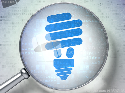 Image of Business concept: Energy Saving Lamp with optical glass on digital background