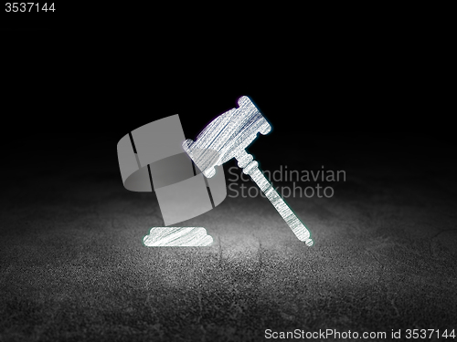 Image of Law concept: Gavel in grunge dark room