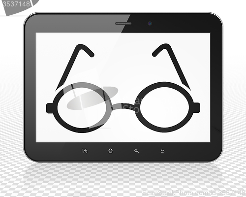 Image of Learning concept: Tablet Pc Computer with Glasses on display