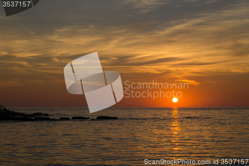 Image of gorgeous sunset on the rocky coast of Adriatic