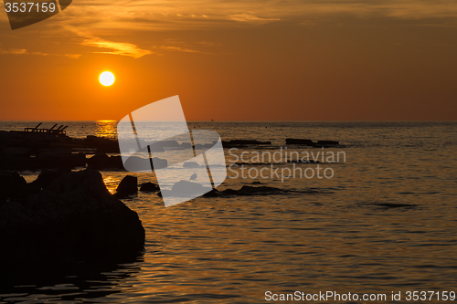 Image of gorgeous sunset on the rocky coast of Adriatic