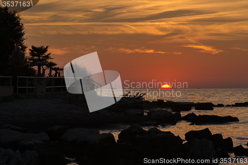 Image of gorgeous sunset on the rocky coast of Adriatic