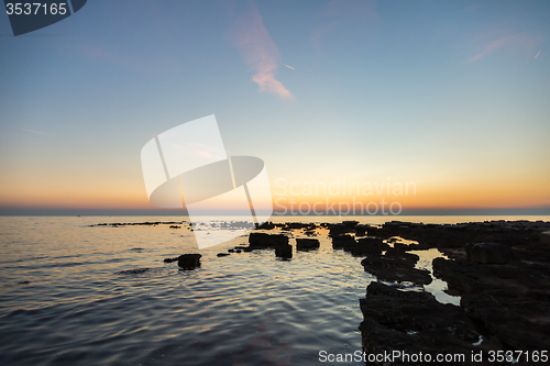 Image of gorgeous sunset on the rocky coast of Adriatic