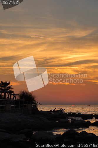 Image of gorgeous sunset on the rocky coast of Adriatic