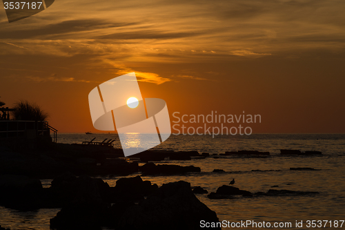 Image of gorgeous sunset on the rocky coast of Adriatic