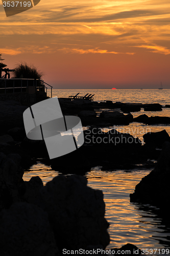 Image of gorgeous sunset on the rocky coast of Adriatic