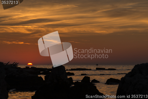 Image of gorgeous sunset on the rocky coast of Adriatic