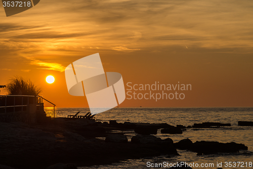 Image of gorgeous sunset on the rocky coast of Adriatic