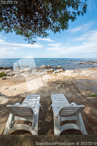 Image of loungers on the rocky beaches