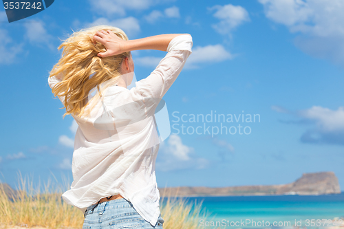 Image of Free Happy Woman Enjoying Sun on Vacations.