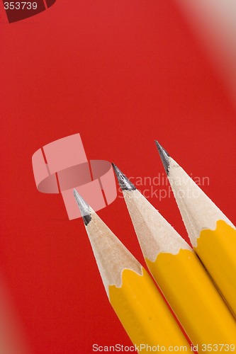 Image of pencils on red background