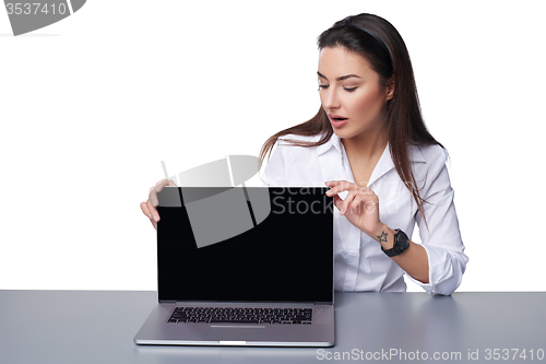 Image of Business woman showing black laptop screen