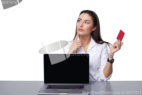 Image of Business woman with laptop showing credit card