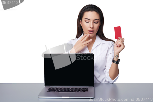 Image of Business woman with laptop showing credit card