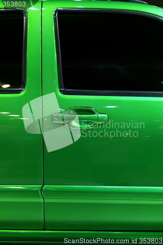 Image of Door of green pickup truck