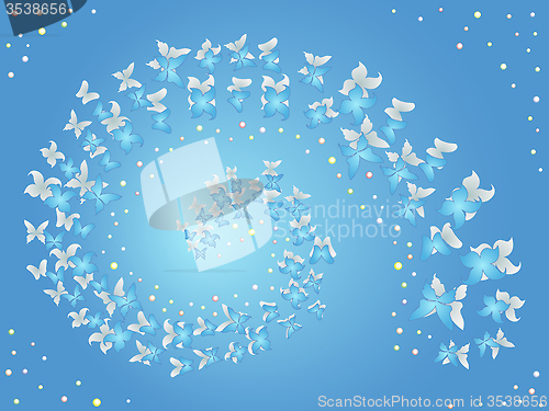 Image of Spiral of flying butterflies on a blue